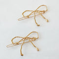 ELLISON + YOUNG: WOBBLY GOLD METAL BOW HAIR CLIP SET OF 2